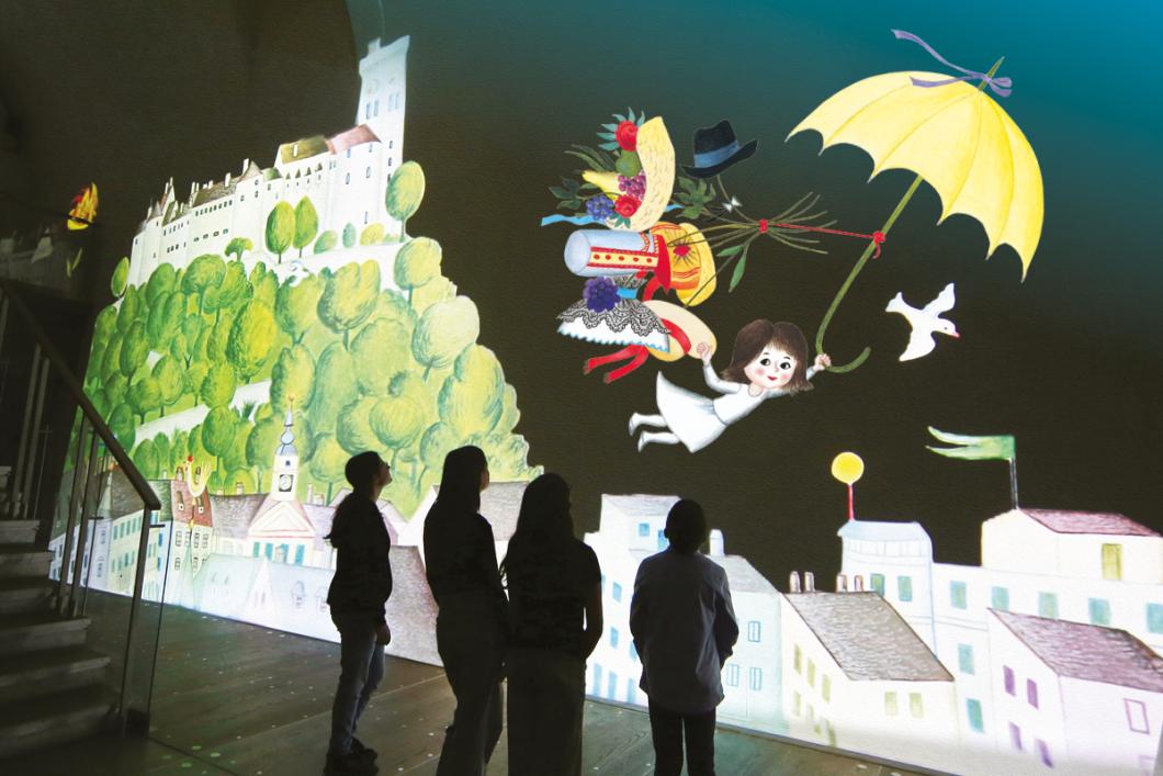 Ko ilustracije oživijo, prostorska projekcija s podobo iz knjige Moj dežnik je lahko balon